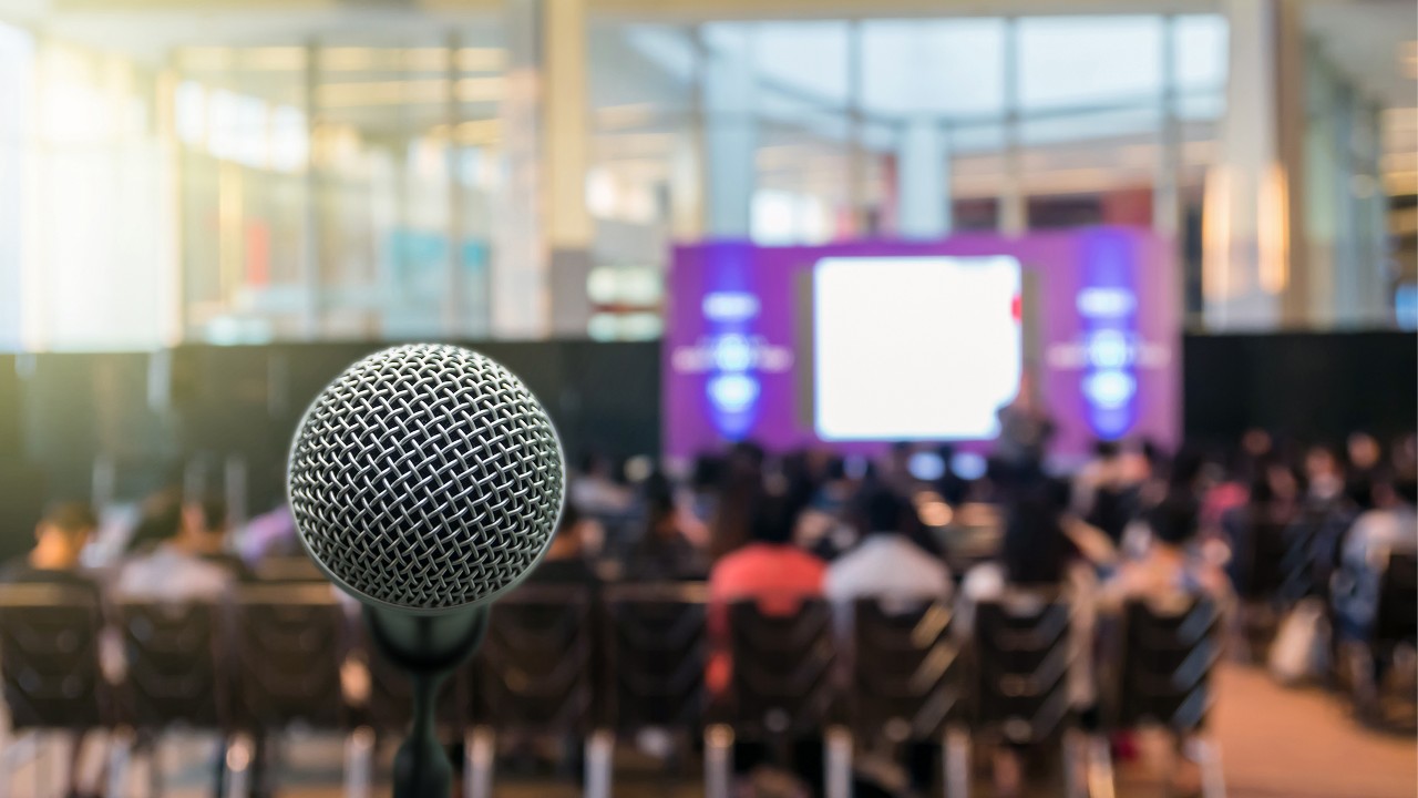 A microphone in a mall; image used for Talk of the market