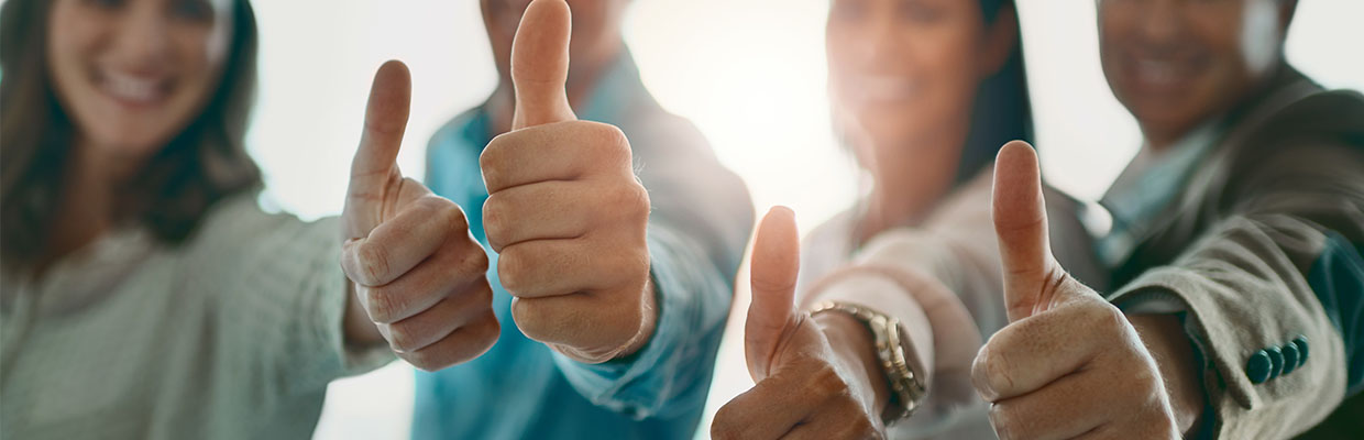 Four people feel good and thumbs up together, image used for "Be your own boss " article