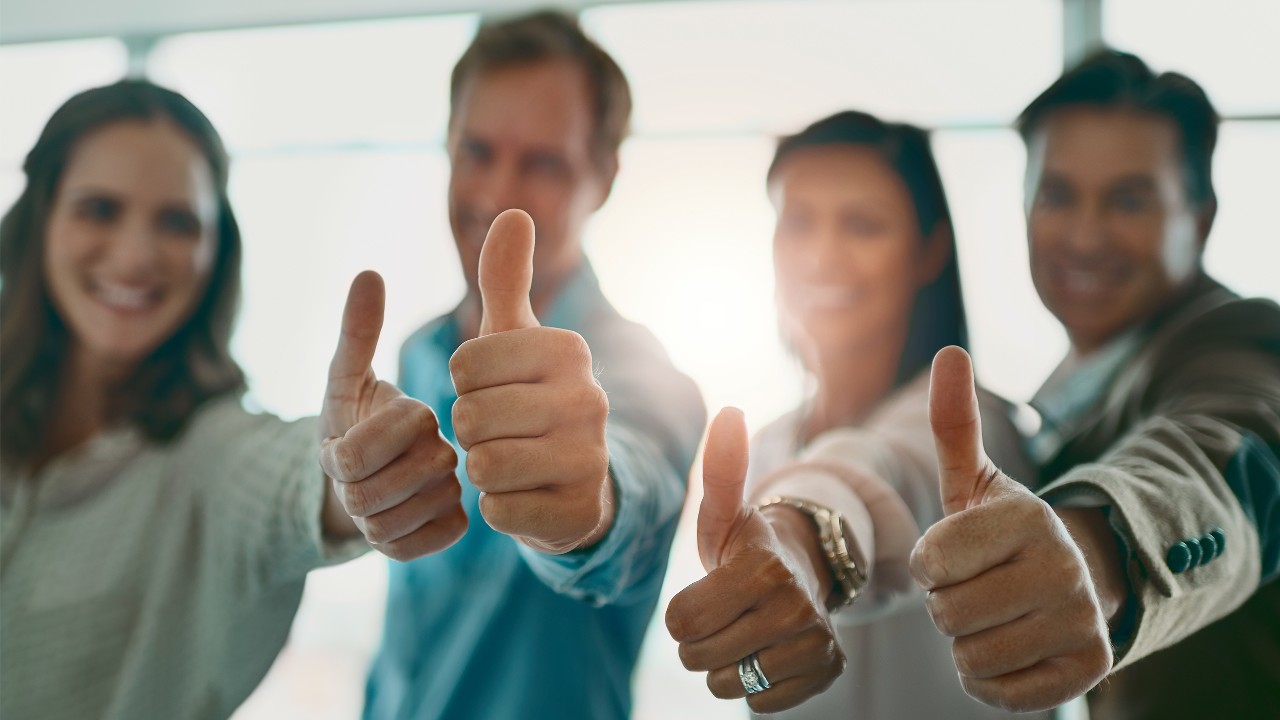 Four people feel good and thumbs up together, image used for "Be your own boss " article