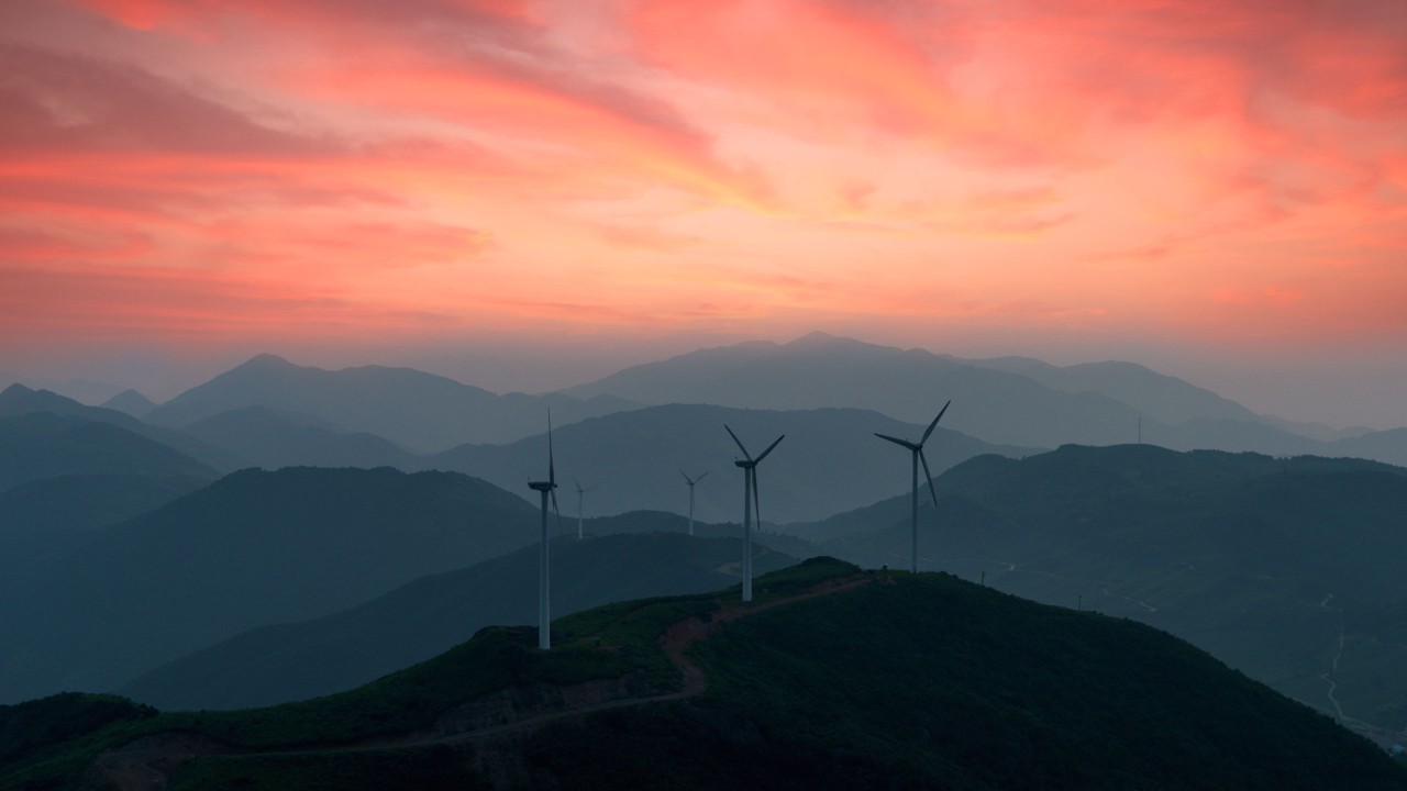 Wind farm at sunset; image used in an article of ESG insights