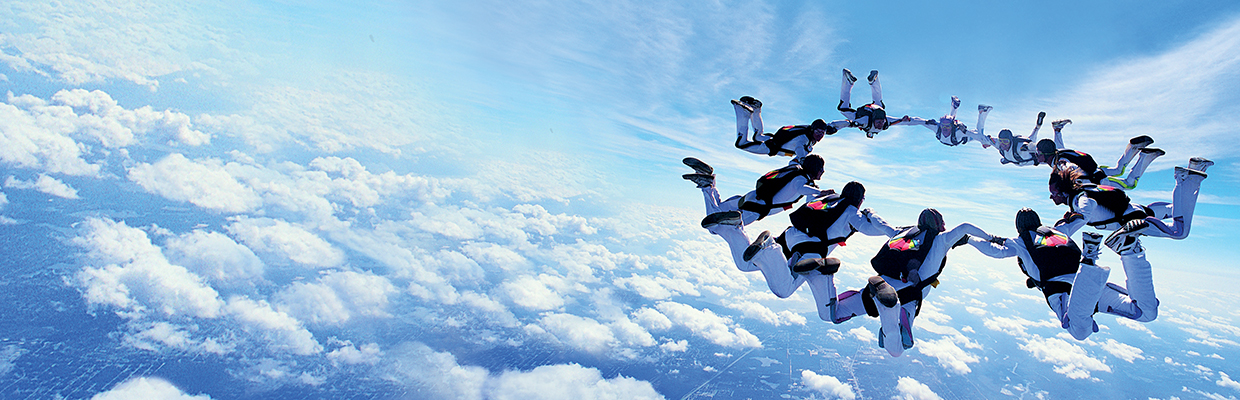 A group of people are skydiving.