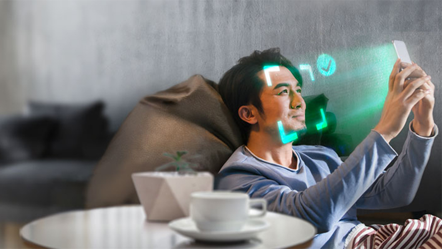 A man playing with smart phone; image used for HSBC Hong Kong mobile account opening page.